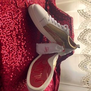 White and gold Christian Louboutin low top sneakers. Comes with extra shoe laces